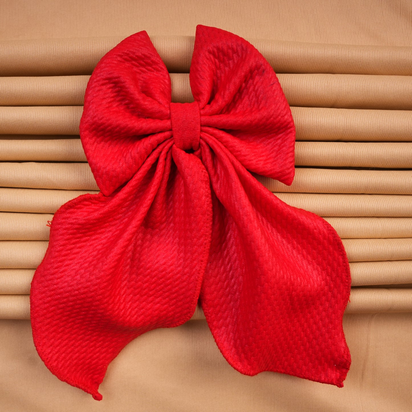 Ruby Flair – Red Leather Textured Hair Bow with Twin Large Leaf Tails